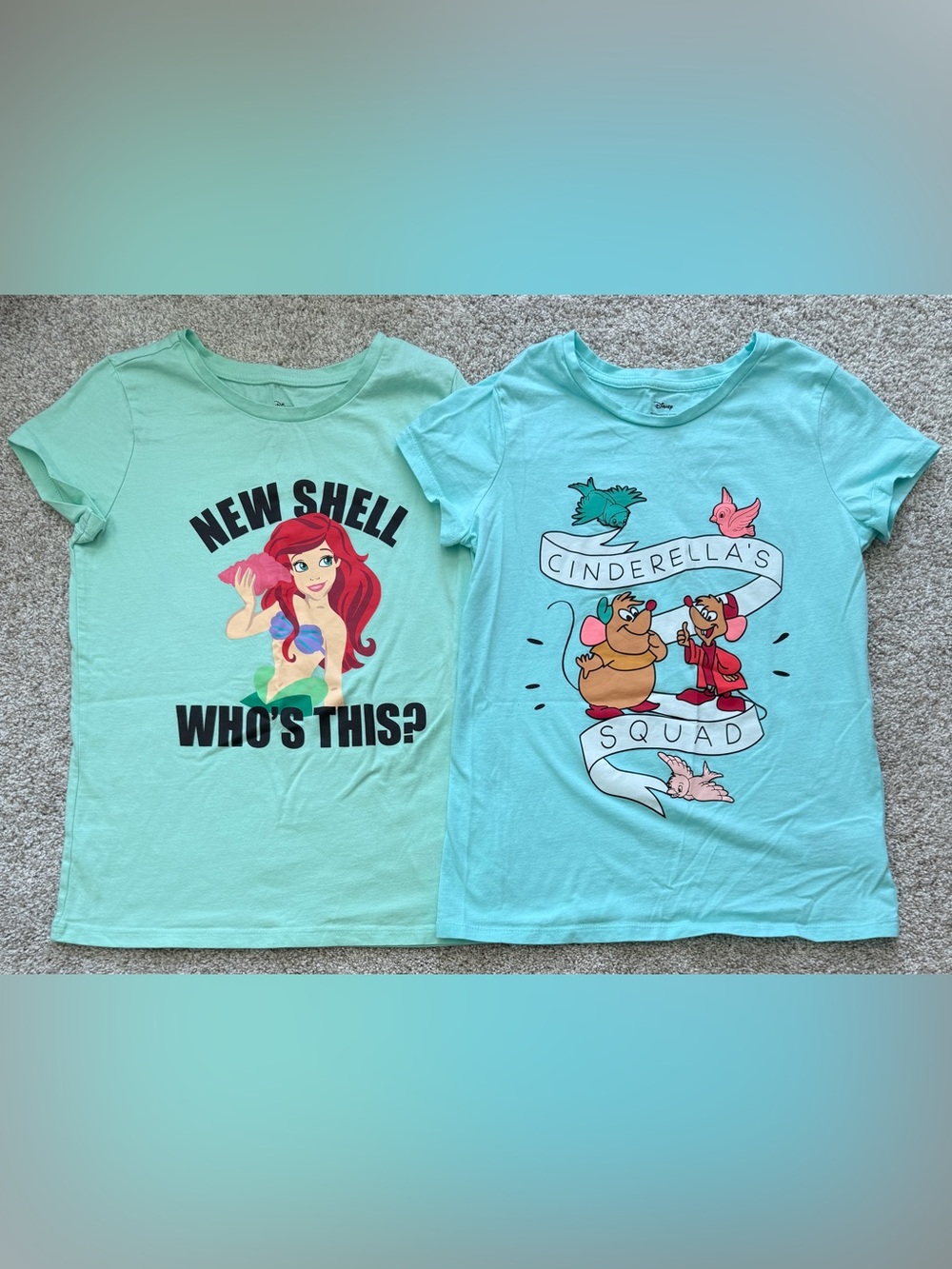 Two Disney T-shirts size girls large.  Cinderella & the little mermaid.